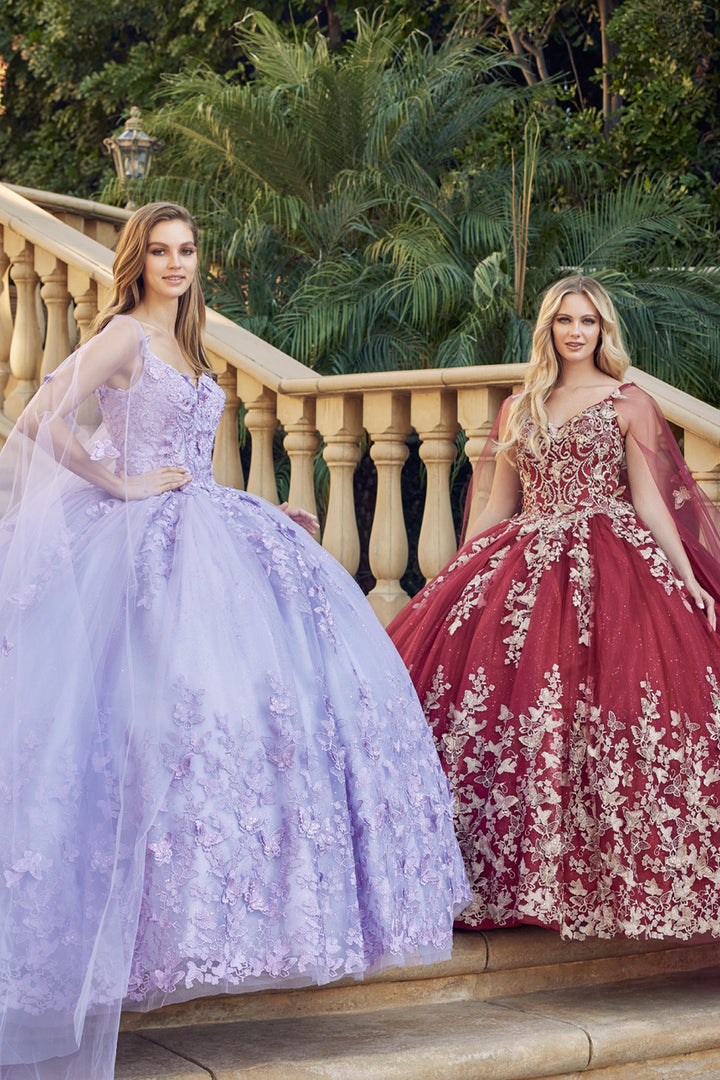 Juliet 1442 butterfly appliqué cape quinceanera dress three-quarter view on staircase, option 2