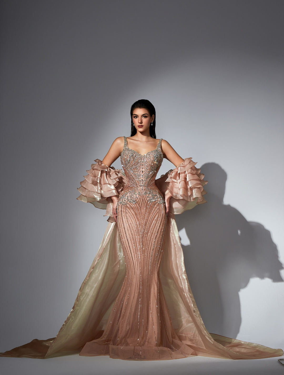 Delilah LD11585 Spaghetti Strap Crystal Corset Mermaid Gown with Ruffle Sleeves and Overskirt - Champagne front view