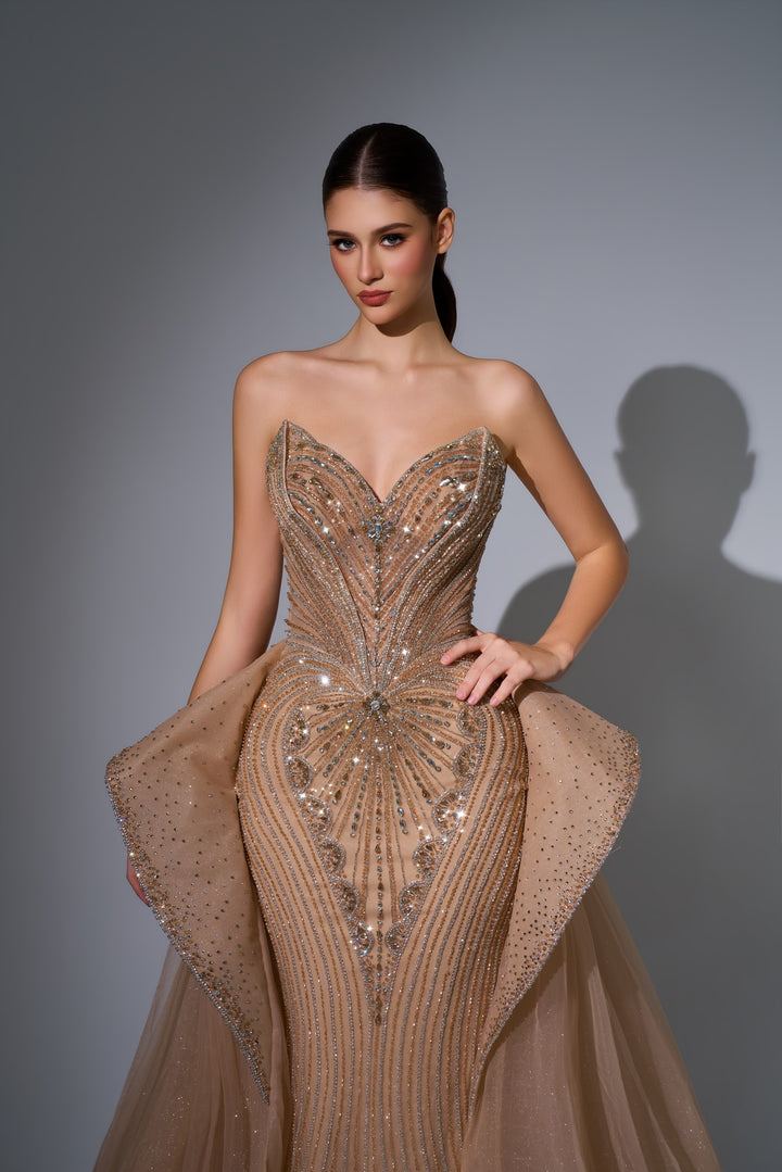 Delilah LD12089 Strapless Plunging Crystal Mermaid Gown with Peplum and Tulle Overskirt - Champagne close-up view