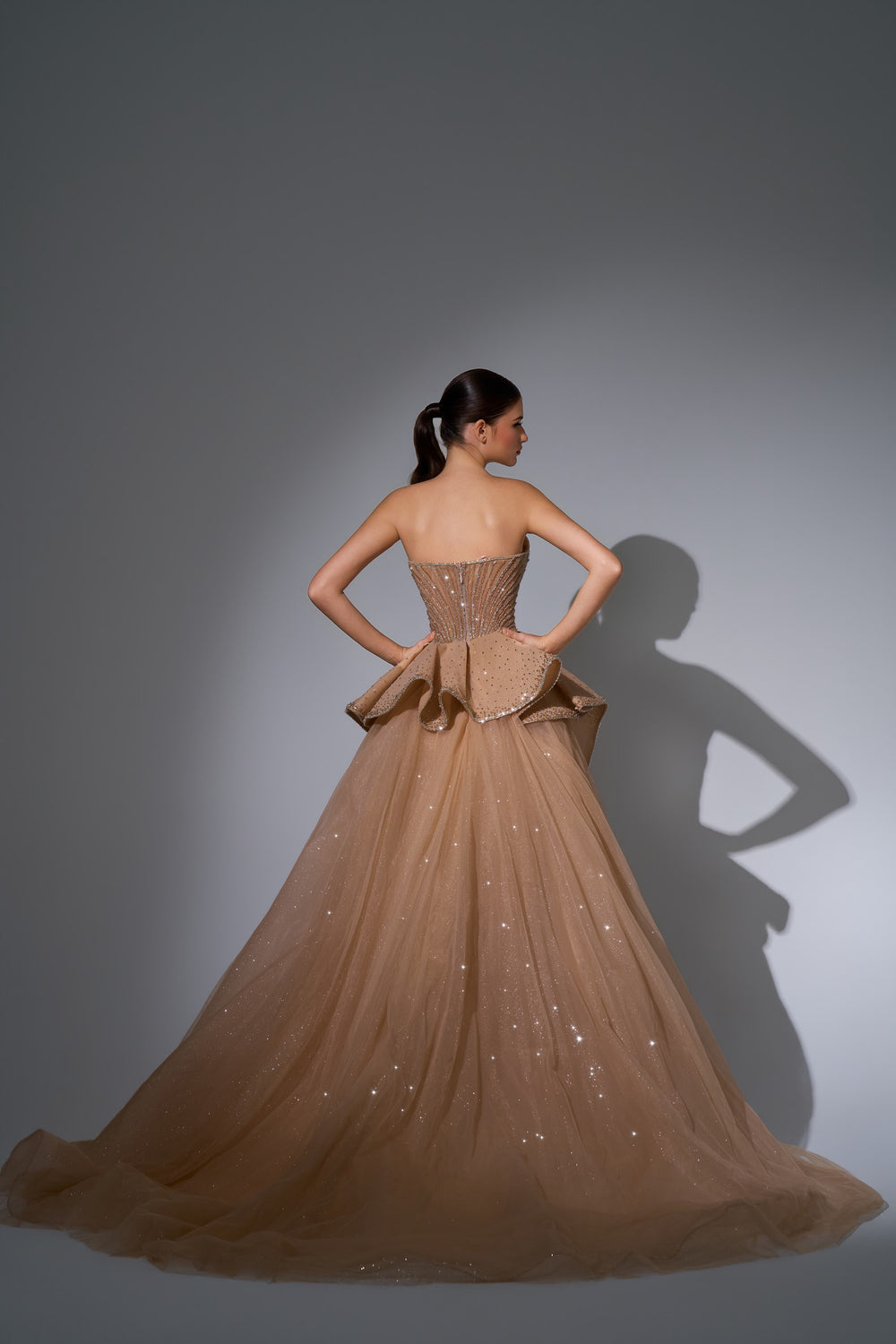 Delilah LD12089 Strapless Plunging Crystal Mermaid Gown with Peplum and Tulle Overskirt - Champagne back view