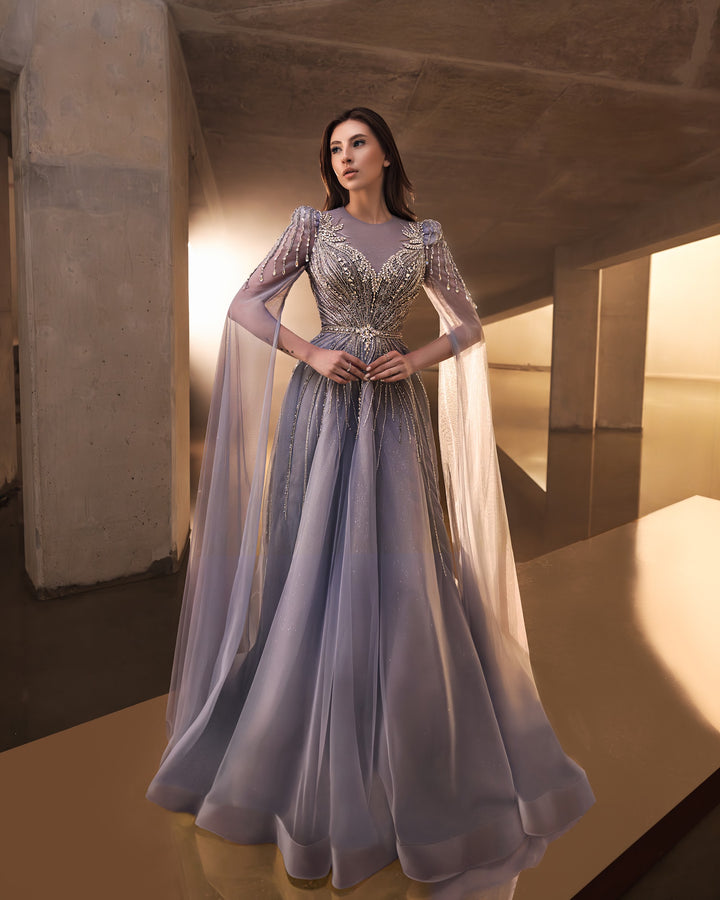 Delilah LD11670 Illusion Neck Long Sleeve Cape Beaded A-Line Gown - G.Blue front view