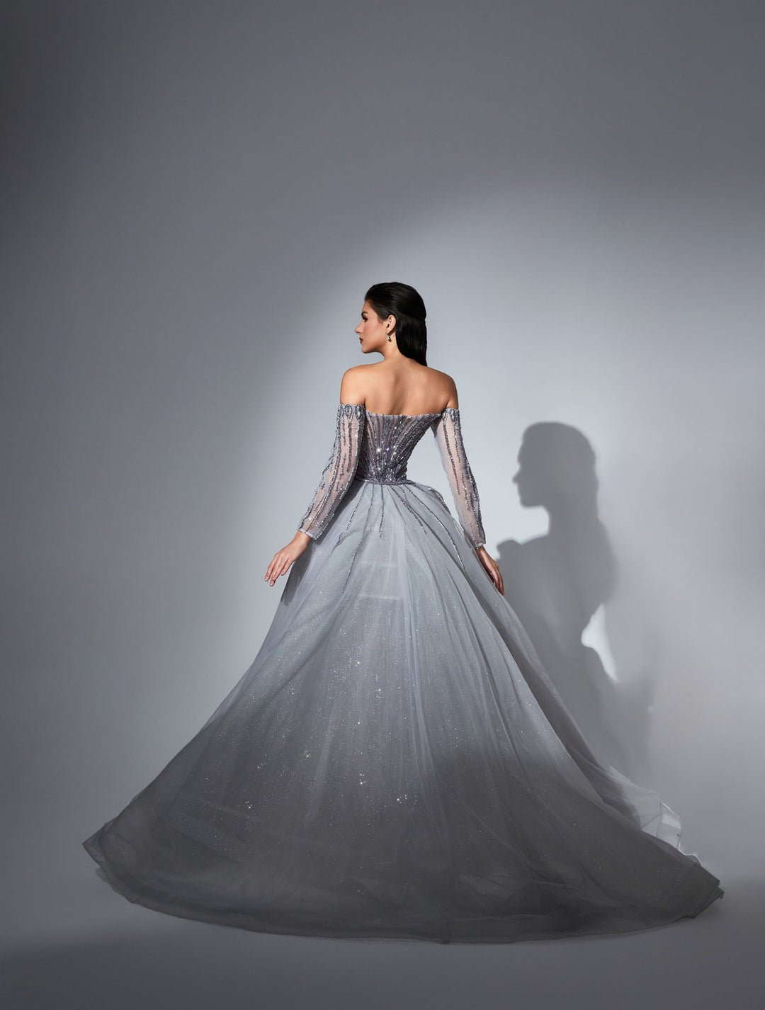 Delilah LD11539 Off-the-Shoulder Long Sleeve Beaded Corset Sheath Gown with Sparkle Overskirt - Purple back view