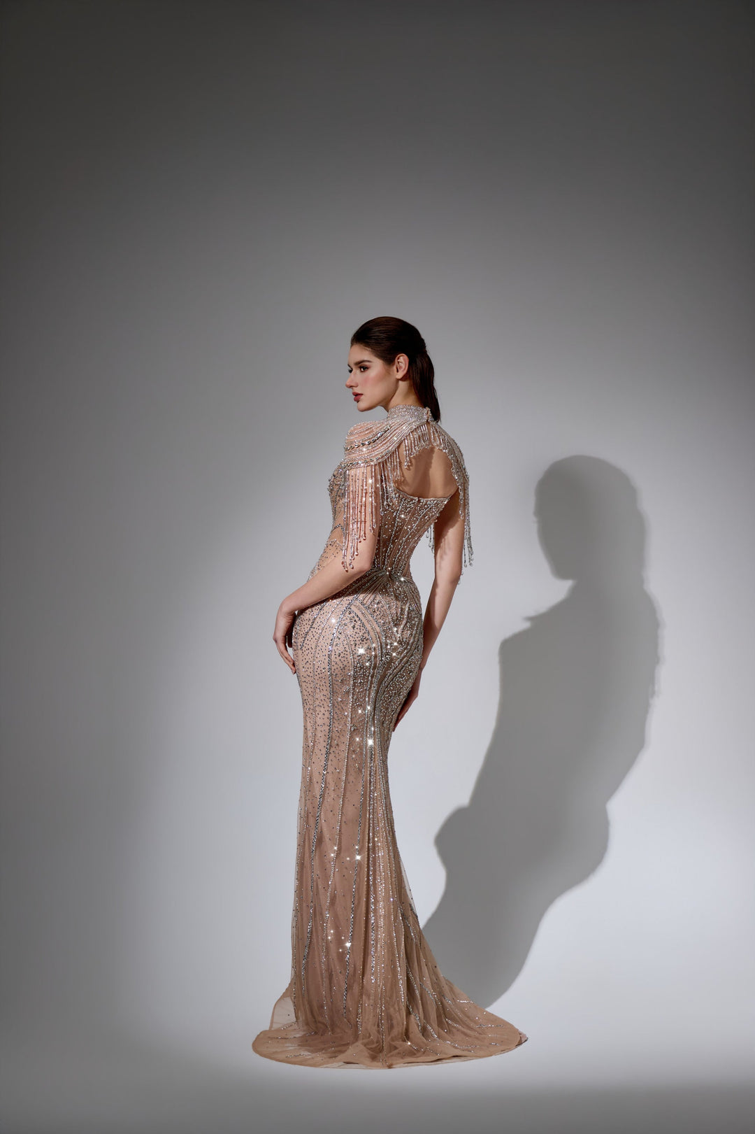 Delilah LD11596 Beaded Corset Sheath Gown with High Choker Collar and Crystal Fringe Shoulders - Champagne back view