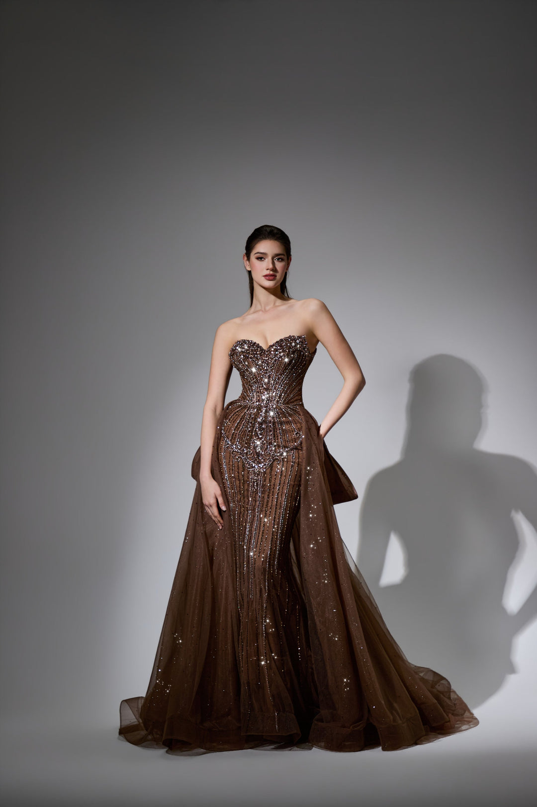 Delilah LD12047 Strapless Sweetheart Beaded Corset Sheath Gown with Bow Overskirt - Brown front view