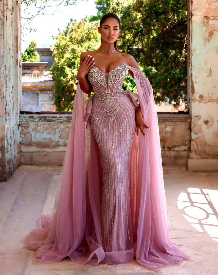 Delilah LD11214 Plunging Sweetheart Beaded Corset Mermaid Gown with Cape Sleeves and Overskirt - Pink front view