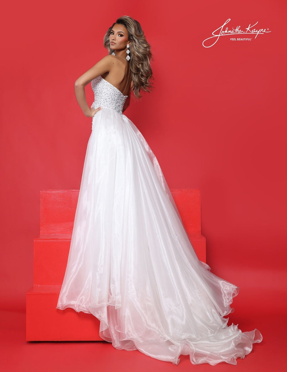 Johnathan Kayne 3356 strapless pageant gown with bow and overskirt back view